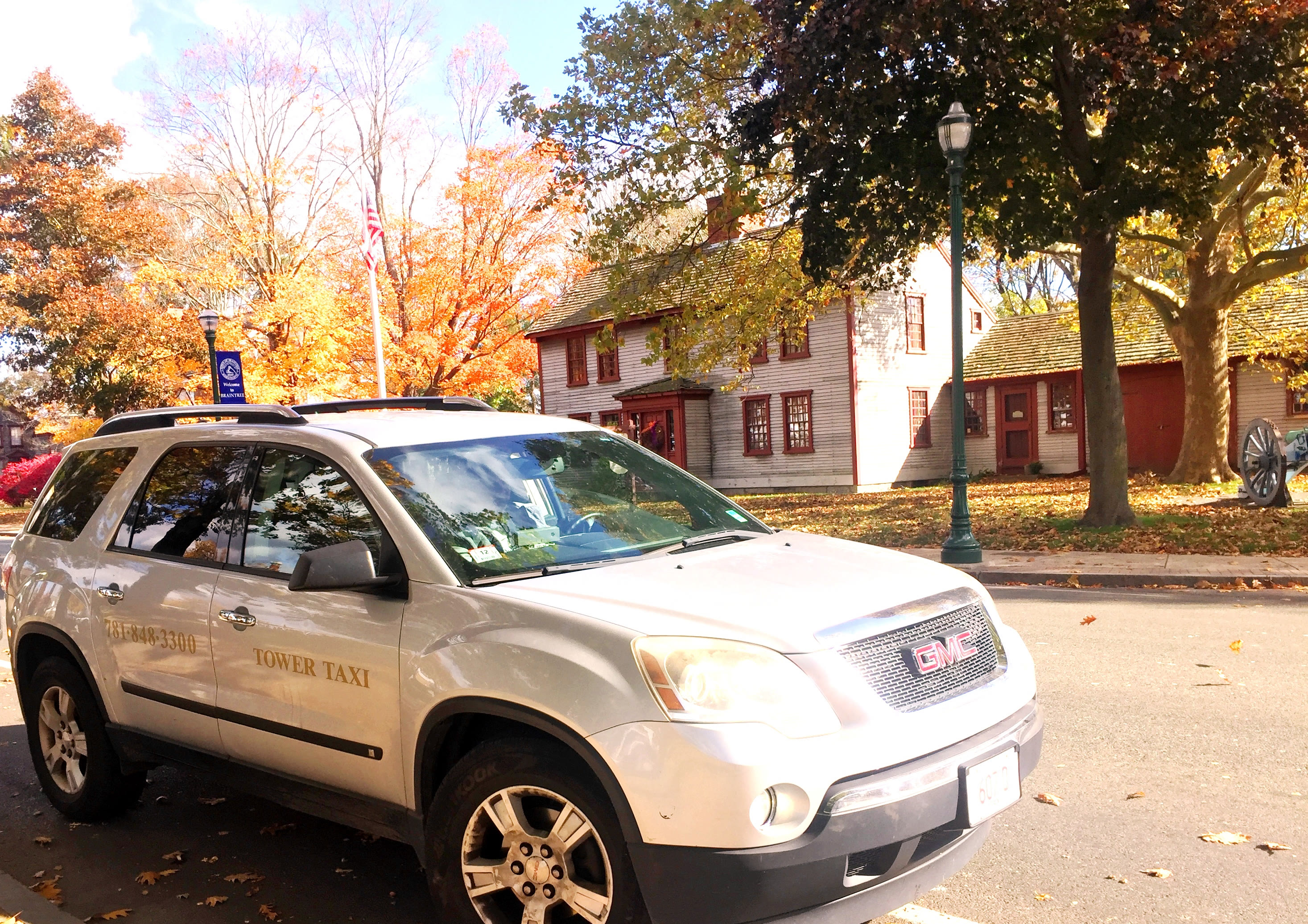 Tower Taxi cab in front of a historic Braintree building