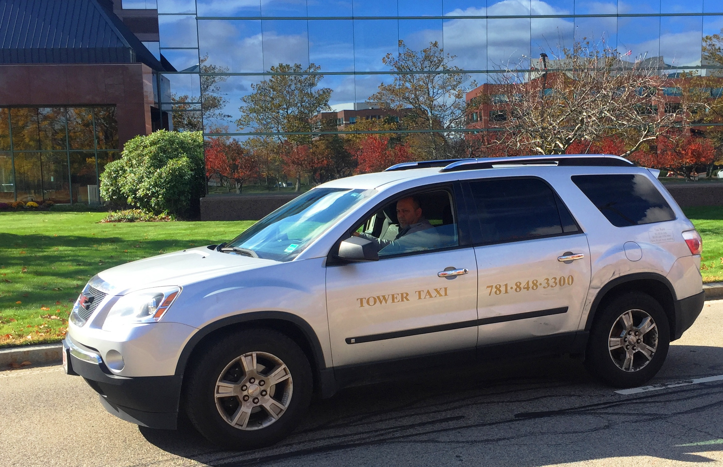Tower Taxi SUV near the Braintree MBTA station